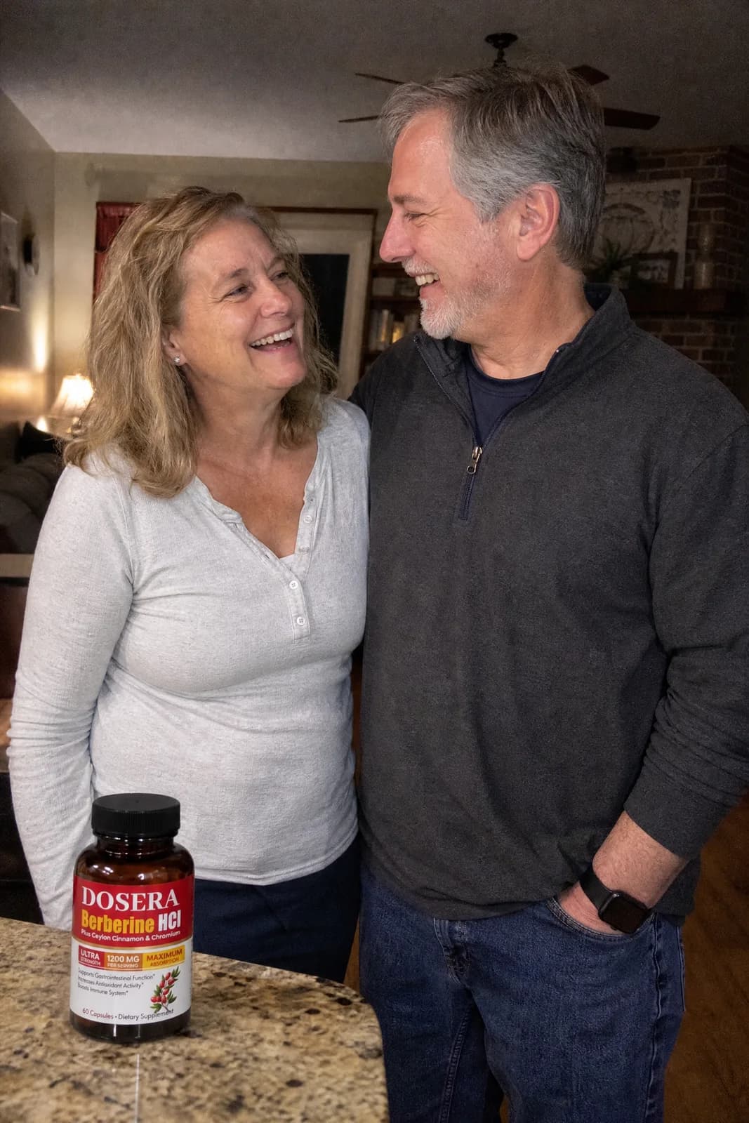 A couple in their fifties on a walk after dinner, relaxed and laughing